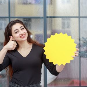 portrait-young-beautiful-girl-holding-idea-bubble-gesture-thumb-up-while-smiling-high-quality-photo (1)