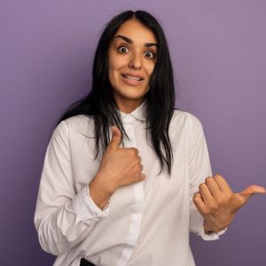 surprised-young-beautiful-girl-wearing-white-t-shirt-showing-thumbs-up-isolated-purple (1)