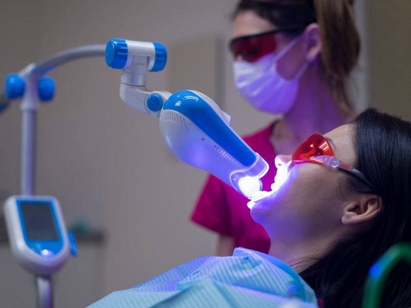 teeth-whitening-procedure-with-ultraviolet-light-uv-lamp (1)